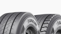 Close-up of two truck tires.