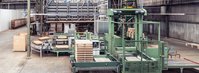A tea palletising machine in a warehouse