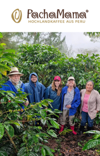 Group of coffee farmers standing together among coffee plants, with the Finca El Manantial logo above.
