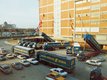 Historic photo of the Vollers site in Bremen where containers are being unloaded from trucks.