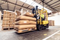 Bags of tea are transported through the warehouse